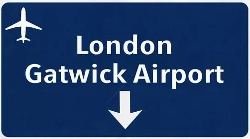 Luxury chauffeur car parked at Gatwick Airport terminal, ready to pick up passengers.
